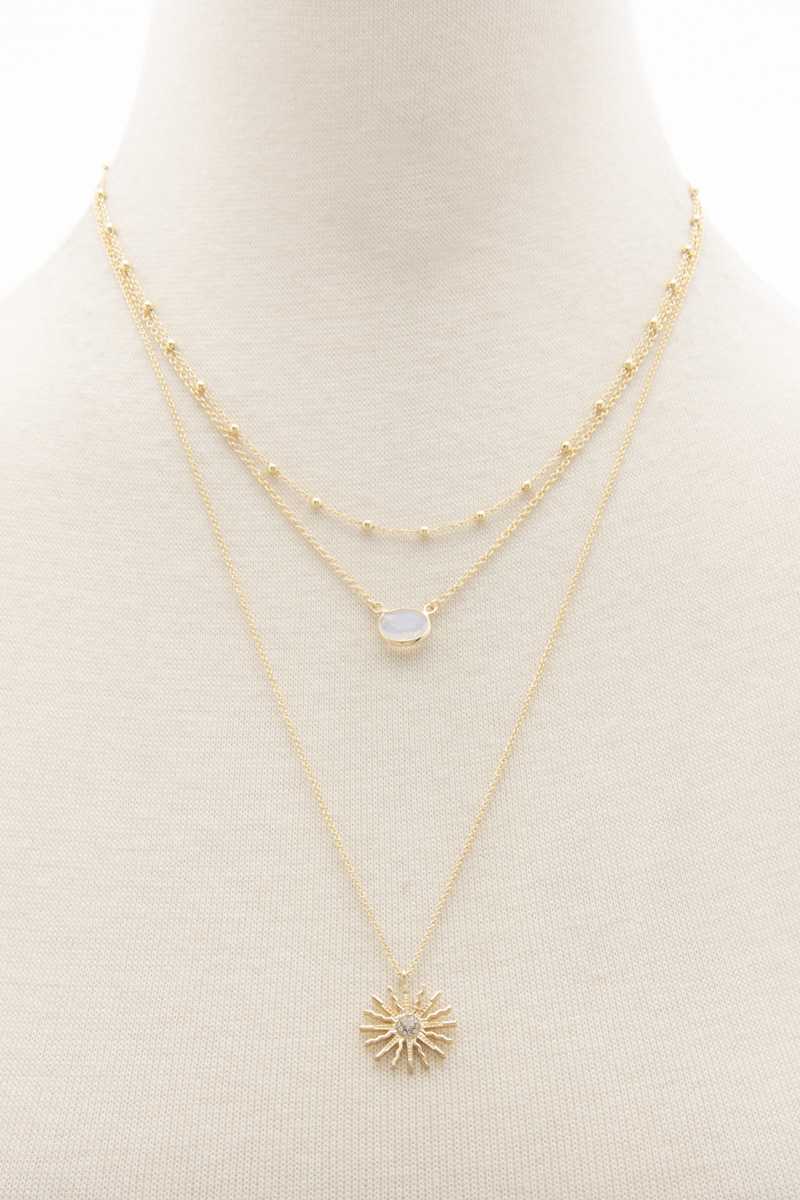 Collier superposé avec pendentif soleil