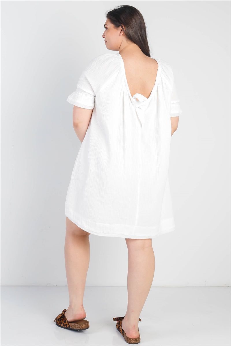 Robe texturée à col rond et deux poches avec ourlet bordé