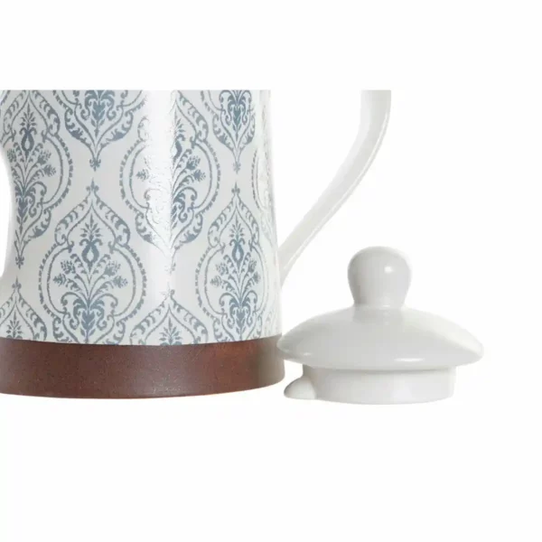 Theiere dkd home decor bleu marron hevea blanc gres_3083. DIAYTAR SENEGAL - Votre Passage vers le Chic et l'Élégance. Naviguez à travers notre boutique en ligne pour trouver des produits qui ajoutent une touche sophistiquée à votre style.