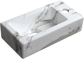 Un petit lavabo de salle de bain au design rectangulaire en marbre à