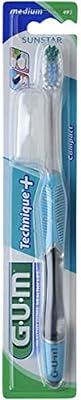 Brosse à dents compacte gum technics à poils moyens - poignée quadruple