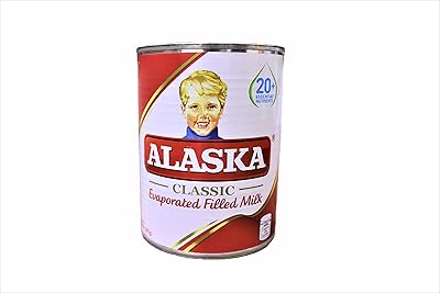 Lait évaporé riche d'alaska, blanc et rouge