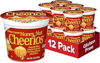 Céréales saines cheerios heart au miel et aux noix dans une tasse, céréales