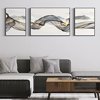 Art mural sur toile avec un cadre doré et noir avec des lignes