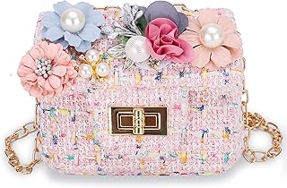 Un petit sac pour petites filles avec une bandoulière avec un joli motif
